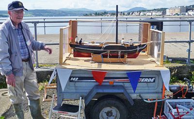 Builder and model
A stalwart of Helensburgh and District Modellers Club, Spike Jones, is pictured with the model of the 1962 Comet replica he helped to build. He and other members sailed the model beside the pier during the bicentenary celebrations in Helensburgh on Saturday August 4 2012, and subsequently donated the model to Helensburgh Heritage Trust for display in the Heritage Centre in Helensburgh Library in West King Street. Photo by Davie Dewar.
