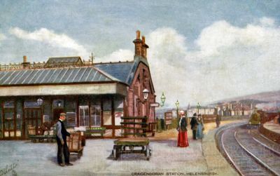 Craigendoran Station
A Tucks oilette postcard of Craigendoran Station with a train coming into the station. The station and steamer terminal opened for business under the North British Railway on May 15 1882, and steamer services were finally withdrawn in 1972. The piers have since become derelict, and on the firth side of the line the station buildings are long gone. Post-dated June 3 1907 to New York, the card has an American one cent stamp on it.

