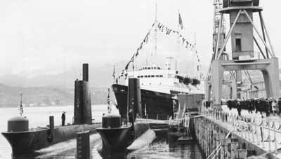 Royal Yacht
The Royal Yacht Britannia berthed at the Clyde Submarine Base at Faslane for a visit by the Queen Mother in May 1968.
