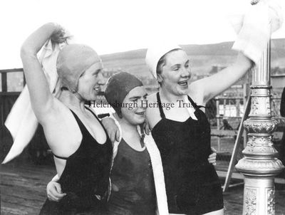 Jubilant Ne'erday swimmers
Lily Finnighan, Helen McDonagh and Jenny Burgess celebrate after taking part in the 1953 Ne'erday Swim at Helensburgh pier. Image supplied by Jenny Sanders.

