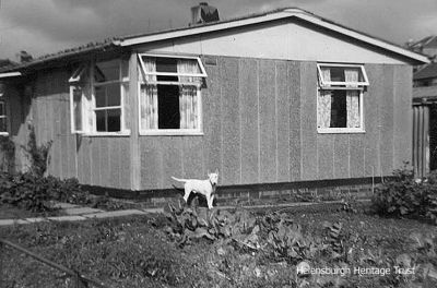 Burgh prefab
The town had a number of prefab homes for several decades, and this one is 2 The Triangle, just behind the Victoria Infirmary and where Johnston Court is now. Image, date unknown, supplied by Helensburgh Memories member Paul Oakes.
