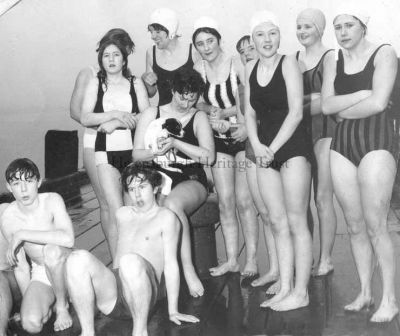 1967 New Year Swim
Chilly swimmers on Helensburgh pier before the start of the 1967 Ne'erday Swim. The girls are (from left) Morag Mackie, Margaret Shields, Sandy MacRitchie holding the puppy, Cynthia Mackie, Alison McLuskie, Christine Ferguson, Catherine Rennie and Irene McGhie. It is thought the boy on the right is Arthur Lawson, but the other boy's name is not known.

