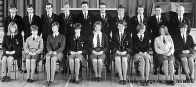 First Prefects
The Prefects for the opening year of the new Hermitage Academy at Colgrain in 1966. Front centre is Dr Margaret Morrison, nee Baird, and immediately behind her is Alistair Quinlan, who supplied this image.
