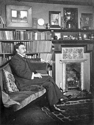 Architect and artist
Architect and watercolourist Alexander Nisbet Paterson (1862-1947) is pictured in drawing room of his Helensburgh home, Long Croft in West Rossdhu Drive, which he designed in 1901 as a family home following his marriage to artist Maggie Hamilton in 1897. His other notable designs include the former Clyde Street School and the War Memorial in Hermitage Park. Image by courtesy of the Anderson Trust.
