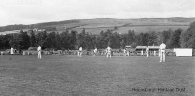 Ardencaple cricket
A Helensburgh Cricket Club match is in progress on the current pitch, while beyond is the Helensburgh Football Club pitch and pavilion. In the distance is the Larchfield School pavilion. Image circa 1930.
