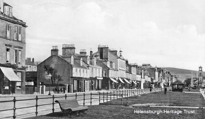 Helensburgh's west esplanade
An old view of the west bay seafront, with railings along the prom and a shelter in the distance. On the other side of the road, where the Augusta Lodge cafe buildings stand now, is the entrance to the former home of Lady Augusta Clavering, elder daughter of the 5th Duke of Argyll. It was a plain, substantial house, built about 1804, with a grass plot in front, and an iron railing next the street. Image date unknown.
