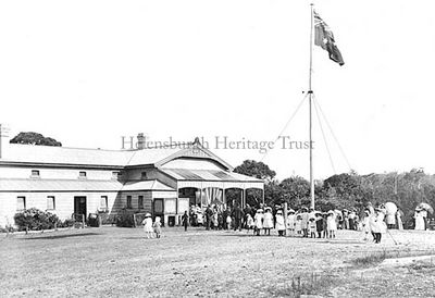 Flag gifted Down Under
Margaret Badham, Assistant Principal at Helensburgh Public School in New South Wales, Australia, supplied this old picture, taken when a red Union Jack was presented to her school by the pupils of our Hermitage School in 1911. The flag is kept in a frame in the school in Australia, and the photo from the school archive shows the raising of the flag for the first time.
