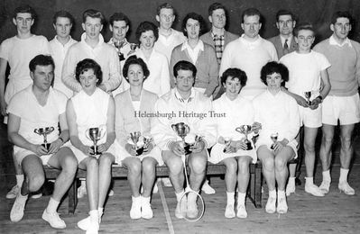 Badminton champions
Helensburgh and District badminton championships winners, circa 1960. Back row: ?, ?, Ronnie Trail, Ken Mercer, Morag Carslaw, ?, Marion Watson, ?, Robert Burns, Johnny Sharp, Alan Miller, Tommy Stewart; front row: Frank Smith, Sheila Campbell, Isobel Campbell, Robert Watt, Kathy Stewart, ?. More names would be welcome.
