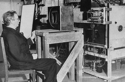 Stereoscopic TV
John Logie Baird with his equipment for providing stereoscopic television pictures in colour. The image forming lens is in the box in front of him. He first demonstrated this in 1928. The image was taken in Sydenham in 1942.
