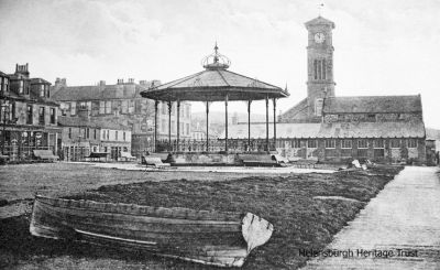 Seafront bandstand
A 1910 image of the bandstand on Helensburgh's West Esplanade, with the Granary building and the Old Parish Church beyond.
