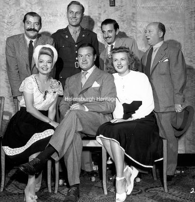 Bob Hope at Rosneath
Hugely popular American entertainer Bob Hope visited United States Navy Base Two at Rosneath with a concert party in 1945, including Frances Langford and Jerry Colona. This picture was taken at a post-show party at the Princess Louise Officers Club, the Ferry Inn. Image supplied by Dennis Royal, author of the book 'United States Navy Base Two â€” Americans at Rosneath 1941-45'.
