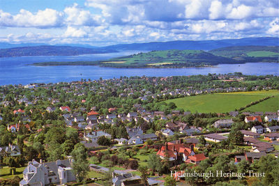 Aerial view
An aerial view of west Helensburgh with the Rosneath Peninsula and Firth of Clyde beyond. In the foreground are the Charles Rennie Mackintosh mansion Hill House and across the road the William Leiper mansion Drumadoon, now renamed Morar House. This photo by Ronnie Weir was published by the Loch Lomond, Stirling and Trossachs Tourist Board. Image date unknown.
