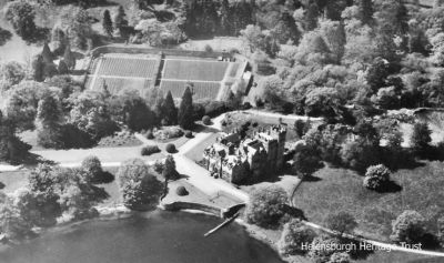 Cameron House
An aerial view of Cameron House on Loch Lomondside, near Alexandria, before it became a luxury hotel. It was the family home of Patrick Telfer Smollett and his wife Gina, surrounded by 25 acres of gardens which for some years he operated as a Bear Park before he sold the property in 1986. The 18th century baronial mansion â€” for a time the home of 18th century novelist and poet Tobias Smollett â€” was steeped in Scottish history, and contained many unique and unusual collections. For three centuries, the Cameron House estate remained in the hands of the Smollett family, originally merchants and shipbuilders from Dumbarton and later wealthy landed gentry. Image date unknown.
