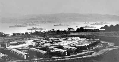 Clyde at war-3
Looking over from Army huts at Portkil, Kilcreggan, towards Gourock, with battleships and cruisers in the foreground. 1942 image supplied by Michael Wilson.
