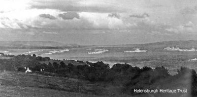 WW2 shipping
A rare World War Two photograph taken from Portkil, Kilcreggan, looking at naval and other shipping in the Clyde between Helensburgh and Greenock. Donated to the Heritage Trust by Michael Wilson, the image is possibly of vessels assembling for the North Africa landings in 1943.
