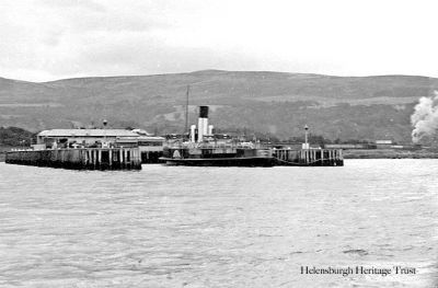 Craigendoran Pier
A view from the sea of a steamer berthed at Craigendoran Pier, with the station in the background. Image date unknown.
