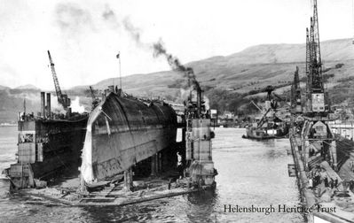 End of a battleship
The German battleship Derflinger is seen arriving at the Faslane yard of Metal Industries Ltd. on board a floating dock in 1946. Launched on June 1 1913, the battleship was scuttled at Scapa Flow on June 21 1919 and lay in 45 metres of water until it raised to the surface in July 1939 â€” the last of the accessible big ships scuttled at Scapa Flow. After the Second World War she was brought to the Gareloch for shipbreaking.
