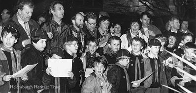 Singing in the rain
Members and leaders of the Helensburgh District Cubs are ready to sing outside on a wet night in 1991. Image supplied by Geoff Riddington.
