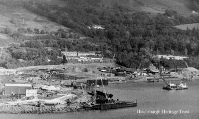 Faslane base construction
Work in progress on construction of the shiplift and finger jetty for servicing nuclear submarines at the north end of the Clyde Submarine Base at Faslane. Work began in 1987 and was completed in 1993. Image, circa 1988, supplied by Jim Chestnut.
