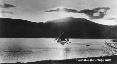 Gareloch sunset
A yacht tows a dinghy as it make its way from Shandon towards Rhu Narrows, circa 1930.
