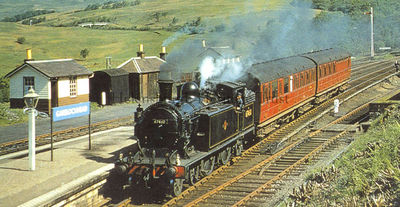 Train at Garelochhead
A steam train passes through Garelochhead Station. The engine no.67460 is a Class C15 push-and-pull, a class designed by Reid and introduced in 1911, weighing some 68 tons. Image date unknown.

