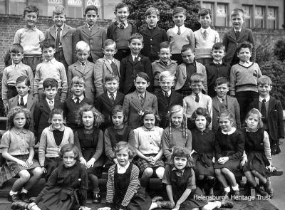 Hermitage class 1943
A Hermitage Primary School class circa 1943. John McAllan, who supplied the image, is top row third from right, second row extreme right Robert Watt, second row middle Drew Ferguson, third row from top extreme right Douglas Lamb, third from right Jim Kennedy, sixth from right George Milne. Others include top row, far right Alister McLeod; third row down, far left Campbell Jardine; third row down, one in on the left Robin Adair; top row, four in from the left John Oswald; fourth row down, one in from the left Edith Clements; third row down, centre Iain Campbell. More names would be welcome. Image supplied by Iain Campbell.
