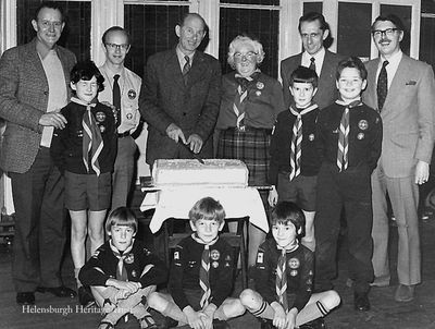 Cutting the cake
Helensburgh Cubs and Leaders at the cutting of the Jubilee cake in the Victoria Hall in 1982. Among those in the picture are Alan Crawford (left), David Reid (2nd from left), Mrs Mary Copeland (centre), John Gorrie (extreme right), his son Peter Gorrie is in front of him. Image supplied by Geoff Riddington.

