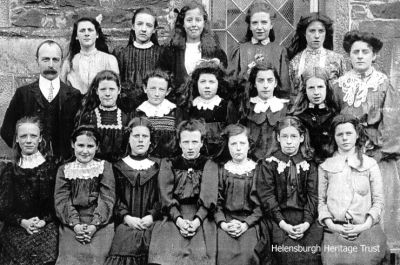 Kilcreggan pupils
Older pupils at Kilcreggan School in 1921, with headmaster George S.Rae. Image kindly supplied by Richard Reeve.
