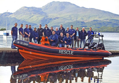 Loch Lomond Rescue Boat
The Luss-based Loch Lomond Rescue Boat, the St John, and its crew pictured at its jetty, with Ben Lomond in the background. This 2007 image â€” which is copyright Lochside Photography, Dumbarton â€” is used by the crew of 22 volunteers to present to sponsors who help with fundraising to meet the Â£12,000 annual running cost.
