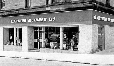 G.Arthur McInnes Ltd.
A 1980s view of G.Arthur McInnes, Drapers, 77-81 Sinclair Street, Helensburgh. It opened on February 15 1929 on the site previously occupied by grocer R.M.Clyde, six years after Robertâ€™s daughter Jean married George Arthur McInnes on January 3 1923. George died in 1937, but Jean carried on until her death in 1941. Her daughter Isobel â€” better known as Belle and wife of Waldies garage boss and town councillor George Aitkenhead â€” ran the business for many years with the aid of manager Duncan Ralph.
