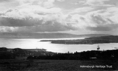 View over loch
A 1918 image of an evening view from above Helensburgh across the Gareloch to the tip of the Rosneath Peninsula. On the left is Kidston Park, with the area below Ardencaple Castle still undeveloped, and to the right is the Training Ship Empress.
