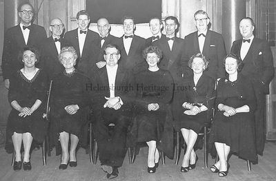 Helensburgh Amateur Operatic Society
Members of Helensburgh Amateur Operatic Society before a performance in the Victoria Hall in the late 1950s-early 1960s. Front (from left): celloist Rosemary Gillies, Mrs Erskine, conductor Arthur Brocklebank, violinist Mary Gray, violinist Mrs R.Paterson, pianist Doris Bryden; standing: unknown professional drummer, trumpeter Frank O'Donnell, unknown, unknown, bass Robert McLaren, clarinet/sax Johnny Campbell, Peter Reece, unknown, Mr Erskine. Image supplied by Lorraine Cavana.
