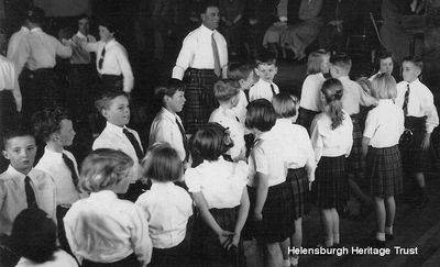 Rhu parents evening
Children prepare to dance at a parents evening in Rhu Village Hall for nursery gardener Alec Parlane's Country Dance Classes, circa 1955. Image supplied by Alistair Quinlan.
