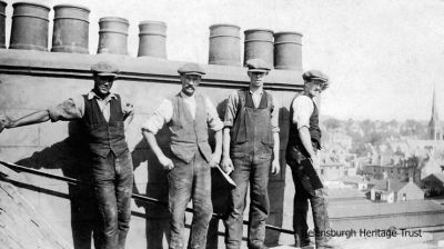 Chimney sweeps
Helensburgh slater, plasterer and chimney sweep Peter Reece and employees on top of a roof, possibly in Maitland Street. Image, date unknown, supplied by Sue Taylor.
