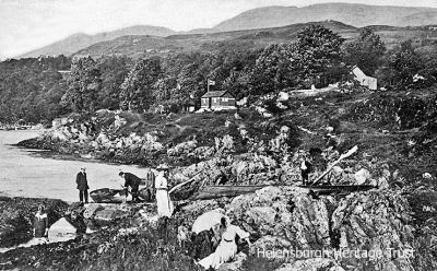 Portincaple shore
A 1912 image of the shore at the Loch Longside fishing village of Portincaple, with several local people on the rocks.
