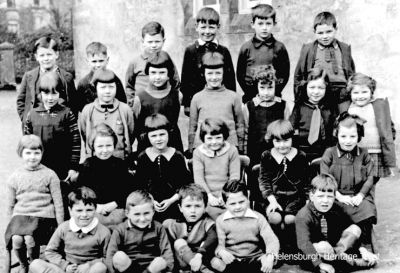 Rhu School c.1935
The teacher and pupils of Rhu Primary School. More details would be welcome. Image supplied by Liz Sutherland, whose dad, Howard Macdonald, is first on the left in the back row.
