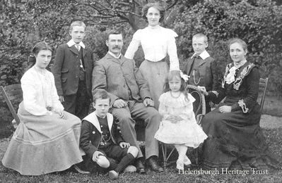 Robert M.Clyde
Robert McIntosh Clyde, founder of the R.M.Clyde grocery business which had several shops in Helensburgh town centre and brother of leading Scottish actor-manager John Clyde, is pictured with his family, probably at the family home, Bramwell Cottage, West King Street. From left: Jean, David, Robert (Bob) seated on the ground, Robert, Annie standing at back, Isobel, James (Jimmy) and Isabella. Image supplied by his great grandson, Alistair Paton.
