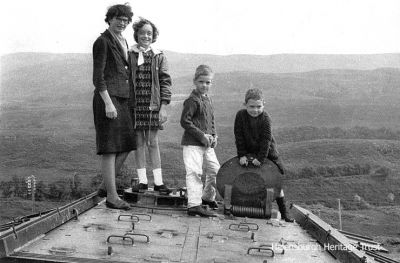 Members of the Rose family from Helensburgh pictured on top of an army tank believed to have been stationed near the road at Whistlefield. The photo was taken by Professor Richard Rose in September 1967, and he believes that it was removed about 10 to 15 years later. Any further information would be welcome.
