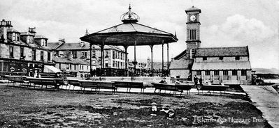 Seafront bandstand
A view of the Helensburgh seafront bandstand with the Granary building and Old Parish Church beyond. Image circa 1906.
