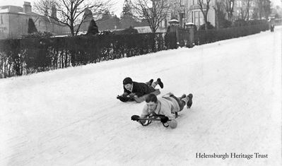 Sledging on Sinclair Street
A well known photo of two boys sledging down Sinclair Street, Helensburgh. Image circa 1910.
