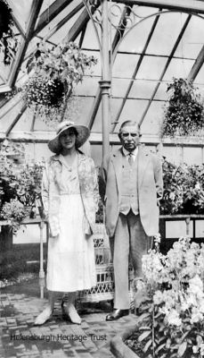 Sir William Raeburn
Sir Wiliam Raeburn, 1st Baronet of Helensburgh, is pictured in the large conservatory at his home, Woodend, Millig Street, in July 1933 with a visiting friend, Marjorie Pipon. Sir William was head of the shipping company of Raeburn & Verel Ltd. Image by courtesy of Dr Nigel Allan.

