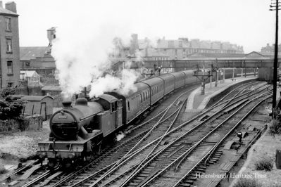 Leaving for Glasgow
A train pulled by the Gresley V1 2-6-2 Tank Locomotive 67611 is seen leaving Helensburgh Central for Glasgow. Image circa 1950.
