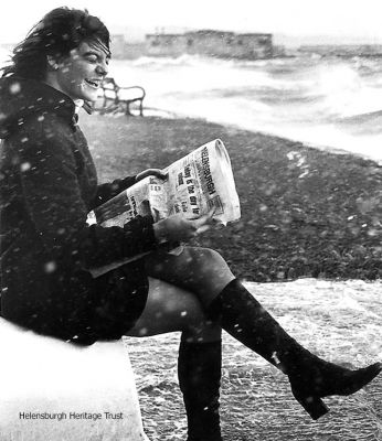 Publicity stint
The headline was "Some people will do anything for a good read of the Helensburgh Advertiser". Staff member Susan Cowan (now Mrs Maxwell) posed with the paper during a seafront gale on December 5 1972. Photo by Donald Fullarton.
