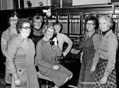 Telephone exchange staff
Staff at the Helensburgh telephone exchange pictured on the last day the exchange operated, October 3 1978. Among those pictured are Peggy McKenzie, Celia Friel, Brenda Copeland, Trixie Dodds and Lexie Caldwell. This image is copyright Helensburgh photographer Brian Averell, who kindly gave permission for it to be published on this website.

