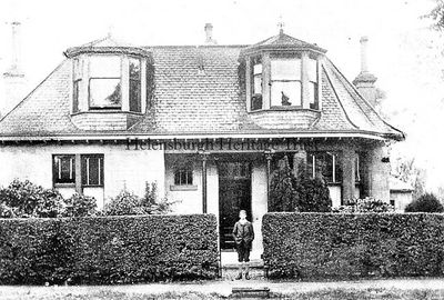 Baird's childhood home
Helensburgh-born TV inventor John Logie Baird poses outside the family home, The Lodge, in West Argyle Street, in 1900.
