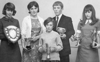 Top Junior Swimmers
Five trophy winners at the Helensburgh Swimming Club prizegiving in the Red Cross Hall, East Princes Street, in October 1968. From left: Jacqueline Craig, Cynthia Mackie, Charlie Cook, Irene McGhie, and in front is Margaret Shields younger sister who collected her award for her.
