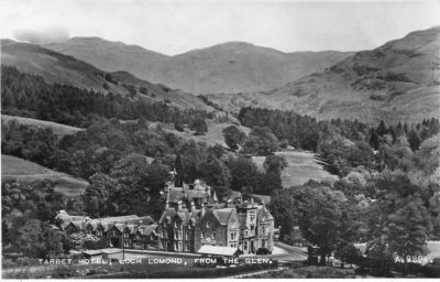 Tarbet Hotel
Erected about 1810, the Tarbet Hotel was built in true Scottish baronial style with fine features both inside and out, and has been a mecca for visitors ever since. Loch Lomond and the road to Crianlarich is to the right, the road to Arrochar to the left.
