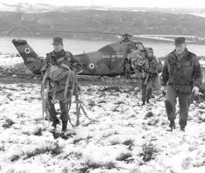 On Exercise
An RAF helicopter brings troops for an Army exercise on the snow clad hills above the Gareloch in February 1970.
