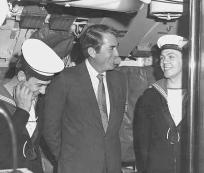 Star Guest
Film star Gregory Peck chats to two ratings on a visit to the Faslane Polaris submarine HMS Repulse. Date unknown.
