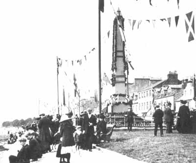 Seafront Celebration
The Henry Bell Monument is decorated with bunting as townfolk celebrate the centenary of Henry Bell's steamship Comet in 1912.
